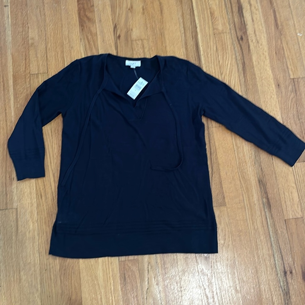 Navy blue loft outlet new with tags light weight sweater with ties on the top.